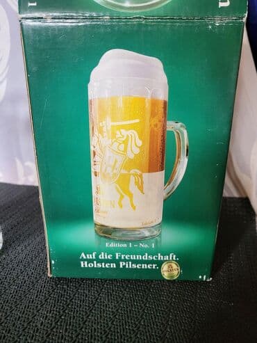jelen pivo krigla: Nova krigla,vintaz Holsten Pilsner. Krigla nova,sve na njoj odsjaj od — 8