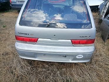 prodaja sedista za automobile: Delovi Suzuki Swift GLX – srebrni hečbek - Generacija sa petoro — 1