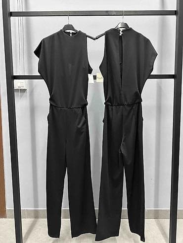kombinezoni 2023: ✅Ženski crni kombinezon – elegancija minimalističkog kroja
✅2400 din — 2