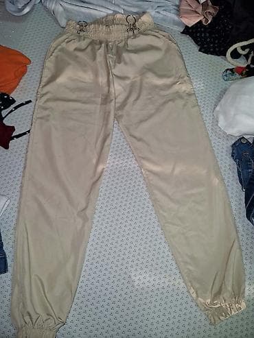 polovna obuca iz inostranstva: Ženske pantalone – dva različita modela. 1. Crne elegantne pantalone — 2