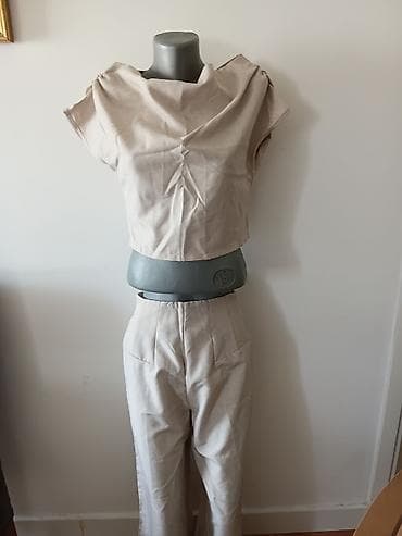 Dvonogi komplet – bež top i pantalone - Model: ženski komplet na lalafo.rs Dvonogi komplet – bež top i pantalone - Model: ženski komplet