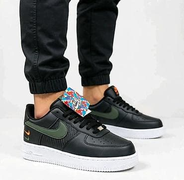 Nike Air Force 1 Low – crne patike sa zelenim Swoosh logom - Model