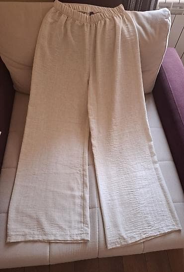 Ženske široke pantalone u svetloj, krem-bež nijansi, sa opuštenim i