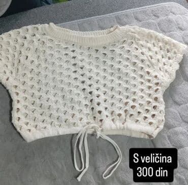 komada odece: Beli ženski kratki džemper, izrađen od heklanog materijala sa — 1