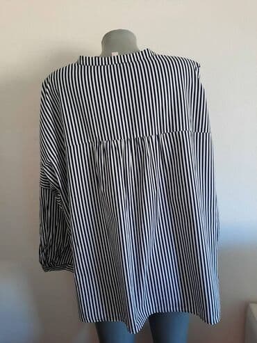 Kosulja Esprit 48 cena 850
pamuk
sirina grudi 72 duzina ledja 67 — 2