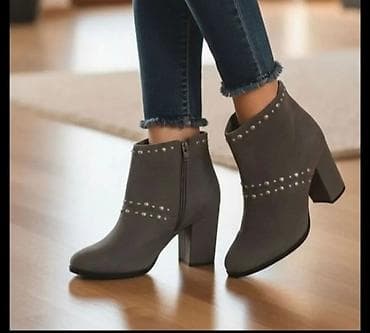 Elegantne ženske gležnjače u sivoj boji sa dekorativnim nitnama. Model