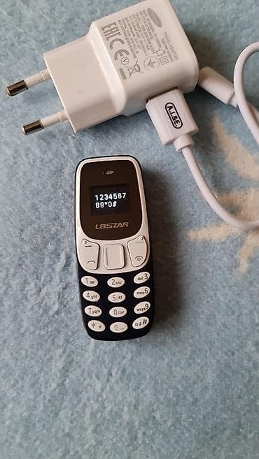 Car Electronics: L8STAR mini mobilni telefon + punjač Opis: - Ultra-kompaktan mobilni — 1