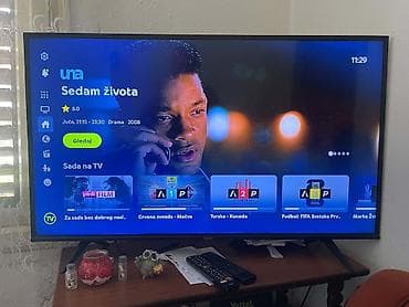 polovna masina za sudove: LED Smart TV VOX, dijagonala oko 50–55 inča (procena po odnosu na sto — 1