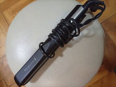 aparati za lice protiv bora: Remington pegla za kosu - Brend: Remington (logo na kućištu) - Tip — 1