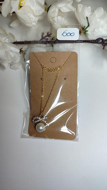 hm torba za plazu: Zlatna ogrlica sa priveskom – biserna kuglica i mašnica od kristala — 2