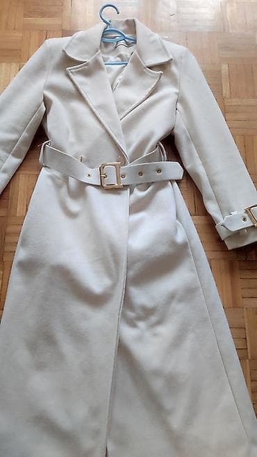 Elegantni ženski kaput sa pojasom – boja slonovače (krem/bela). -
