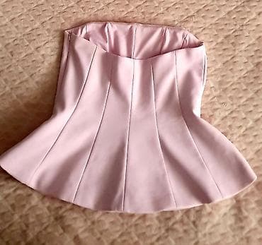 ZARA korset-top bez bretela u puder roze boji. Model sa strukiranim