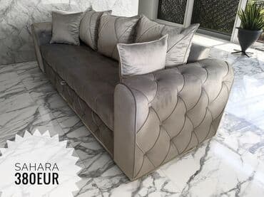 vitorog kauc: Elegantna sofa u sivoj boji, presvučena somotom, sa karakterističnim — 1