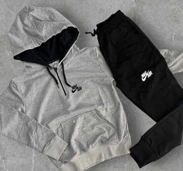 nike tech fleece komplet srbija: Muška trenerka sa kapuljačom i crnim donjim delom. Gornji deo je plave — 2