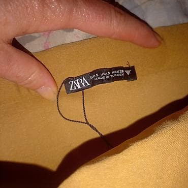 ZARA midi suknja u kamel/oker boji. Model sa visokim strukom i olovka