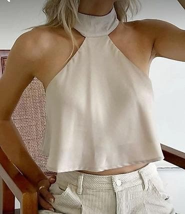 Kosuljica kraca siroka,oko vrata vezuje se pozadi