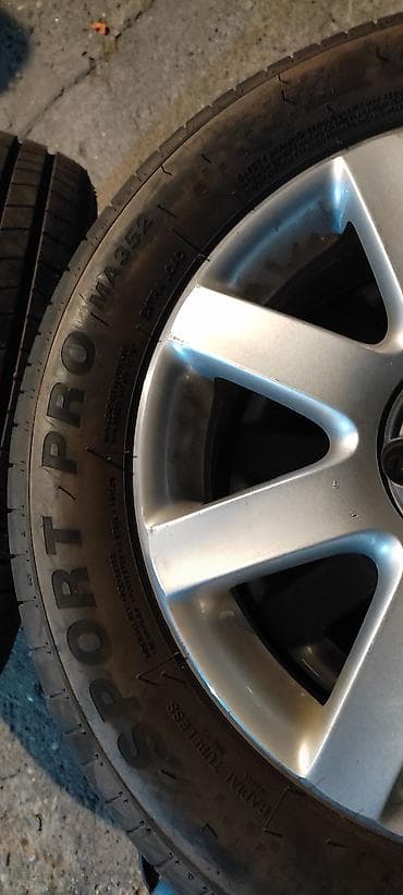 osovina auto: Komplet od 4 aluminijumske felne sa gumama za Volkswagen. - Model — 4