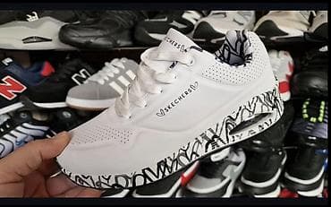 Skechers ženske patike – bele, sa crno‑belim grafičkim detaljima na