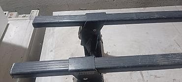 Auto oprema: Thule krovni nosači – set od dve uzdužne šine sa nogama/držačima - — 2