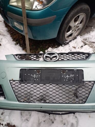 Auto delovi: Prednji branik za Mazda 5 Branik je svetlo zelene boje, opremljen