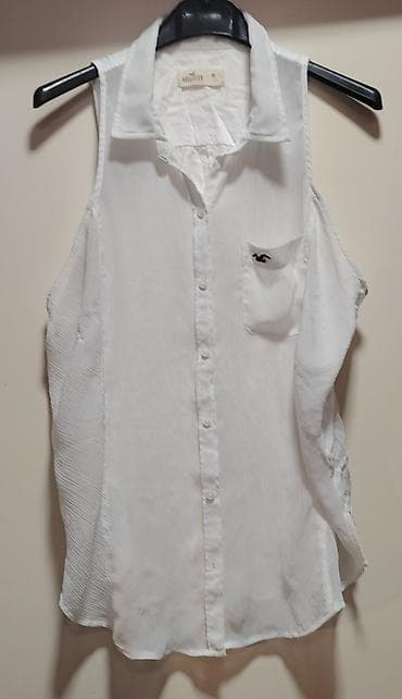 logo zaba na proizvodima: Bela ženska bezrukavna košulja na kopčanje. - Brend: Hollister - — 1