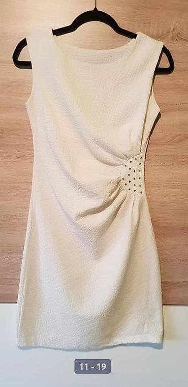 judina žena: Elegantna krem/pastelno-bela haljina bez rukava, kroj iznad kolena — 2