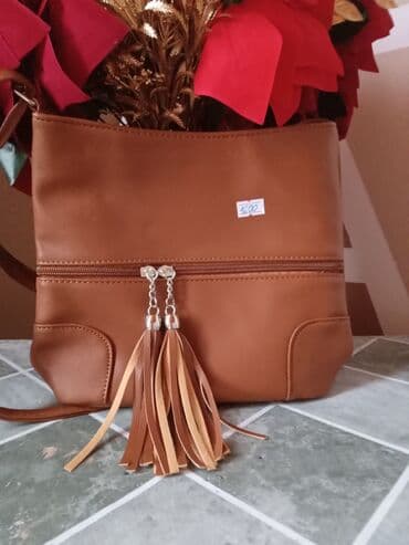 Aksesoari: Ženska crossbody torba u kesten/camel braon boji. - Materijal — 1