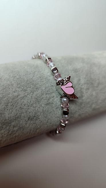 torbe za plazu ps: Nježna narukvica sa privjeskom u obliku srca sa krilima u roze boji — 2