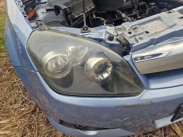 sprej za ciscenje farova: DESNI FAR CRNI ZA OPEL TIGRA | Svi delovi za Opel vozila : Astra G — 1