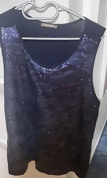 Orsay tunika-majica sa šljokicama, veoma efektna i lako uklopiva. L