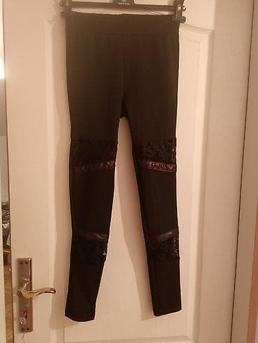 Women's Clothing: Crne ženske helanke sa dekorativnim detaljima - Model: uske helanke — 1