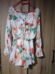 Haljina cvetna s M l. Nova sa etiketu. Lastrez u struk