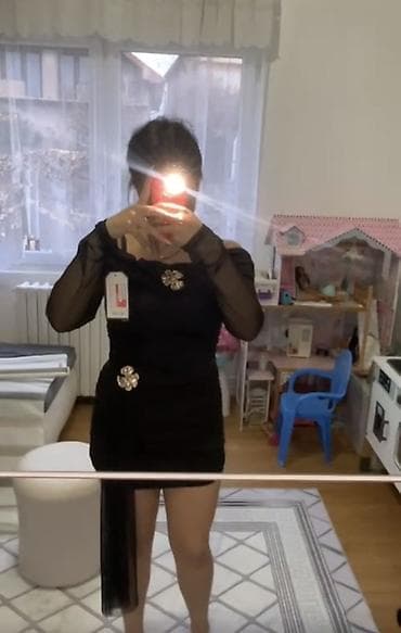 Elegantna crna mini haljina sa prozirnim rukavima i asimetričnim na lalafo.rs Elegantna crna mini haljina sa prozirnim rukavima i asimetričnim