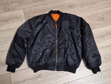new yorker crna gora online: Crna bomber jakna (MA-1 stil) sa narandžastom postavom. - Materijal — 1
