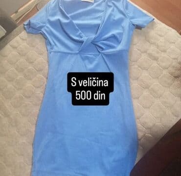 zenski kompleti: Jednobojna ženska mini haljina svetloplave boje. Haljina je kratkih — 1
