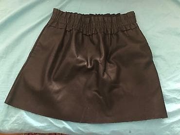 Noca crna suknja s elastičnim strukom, mekanog materijala, udobna za na lalafo.rs Noca crna suknja s elastičnim strukom, mekanog materijala, udobna za