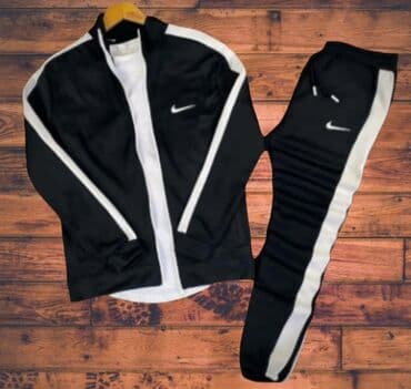 nike patike sa krznom: Crno-bela muška trenerka sa jaknom na rajsferšlus i pantalonama. Jakna — 1