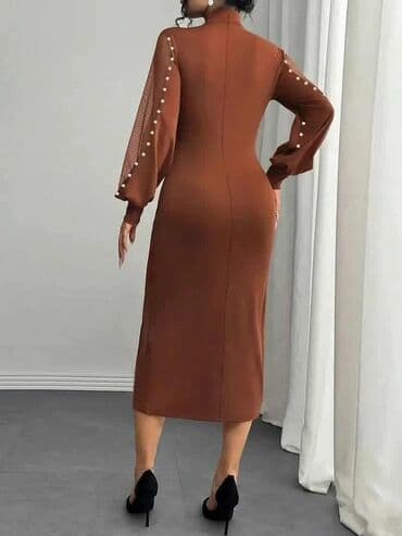 Elegantna midi haljina u toploj braon boji, kroja koji prati liniju na lalafo.rs Elegantna midi haljina u toploj braon boji, kroja koji prati liniju