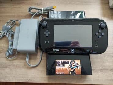 **SNIZENO** Prodajem crnu Nintendo Wii U konzolu 32gb + 128gb na lalafo.rs **SNIZENO** Prodajem crnu Nintendo Wii U konzolu 32gb + 128gb