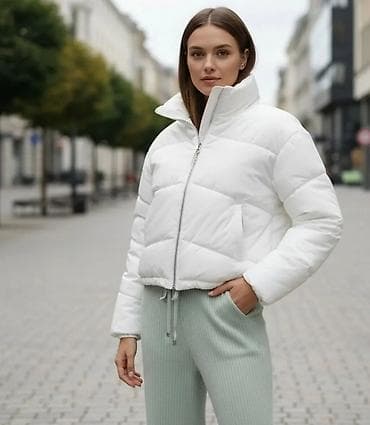 Ženska zimska puf jakna – bela - Kratki, moderno krojeni model sa na lalafo.rs Ženska zimska puf jakna – bela - Kratki, moderno krojeni model sa