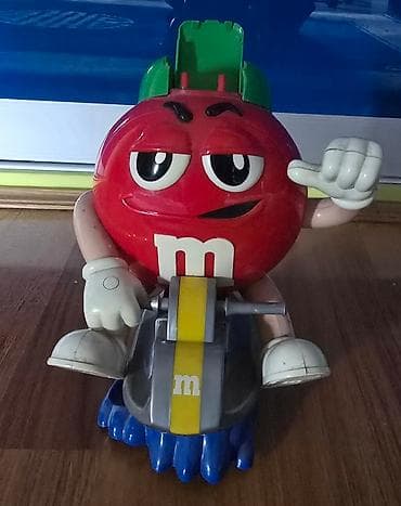 MM - M&M bonbone se ubace, i kad se povuce ruka ispadaju. Igracka na lalafo.rs — 1 MM - M&M bonbone se ubace, i kad se povuce ruka ispadaju. Igracka — 1