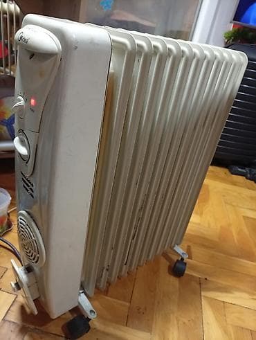 Uljani radijatori: Uljeni radijator Midea sa 12 rebara i ispravnim ventilatorom - Tip na lalafo.rs — 6 Uljani radijatori: Uljeni radijator Midea sa 12 rebara i ispravnim ventilatorom - Tip — 6