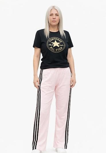 Ženske trenerka pantalone – svetloružičaste sa crnim prugama - Model na lalafo.rs Ženske trenerka pantalone – svetloružičaste sa crnim prugama - Model