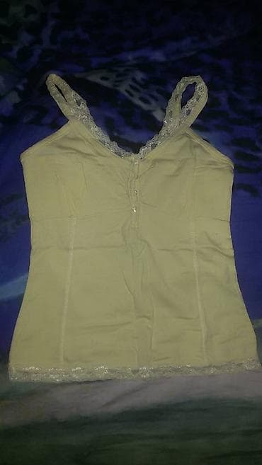 Na prodaju svetlo žuta majica na bretele, ima elastina, M veličina na lalafo.rs Na prodaju svetlo žuta majica na bretele, ima elastina, M veličina