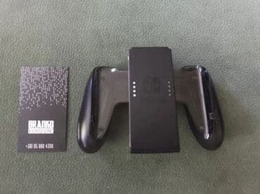 Original Nintendo Switch JoyCon (joy con) CHARGING Grip Grip + punjac na lalafo.rs Original Nintendo Switch JoyCon (joy con) CHARGING Grip Grip + punjac