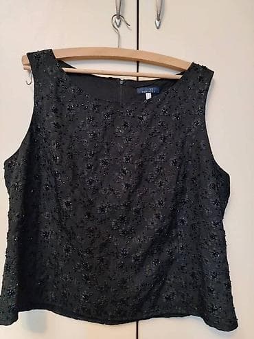 Elegantna ženska top majica u crnoj boji, ukrašena šljokicama i na lalafo.rs — 1 Elegantna ženska top majica u crnoj boji, ukrašena šljokicama i — 1