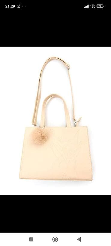 Ova uniseks torba bež boje odlikuje se diskretnim utisnutim likom na lalafo.rs — 1 Ova uniseks torba bež boje odlikuje se diskretnim utisnutim likom — 1