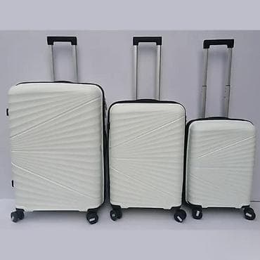 Travel suitcases and bags: === PART 1: TEXTUAL DESCRIPTION === Set od tri bela kofera sa tvrdim at lalafo.rs — 1 Travel suitcases and bags: === PART 1: TEXTUAL DESCRIPTION === Set od tri bela kofera sa tvrdim — 1