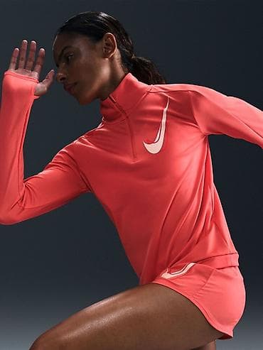 Women's T-shirts and tops: NIKE Dri-FIT Swoosh Graphic Magic Ember Women's Running Shirt vel. S at lalafo.rs — 1 Women's T-shirts and tops: NIKE Dri-FIT Swoosh Graphic Magic Ember Women's Running Shirt vel. S — 1