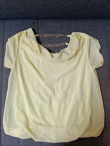 Ženska bluzica u svetložutoj boji, laganog i lepršavog kroja. - na lalafo.rs — 2 Ženska bluzica u svetložutoj boji, laganog i lepršavog kroja. - — 2